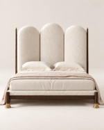 Arched upholstered bed Qatar – ivory triple-panel headboard with dark wood frame and brass legs