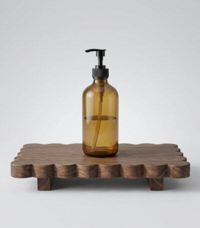 Original solid wood home decor rack with scalloped edge holding a soap dispenser and potted ivy