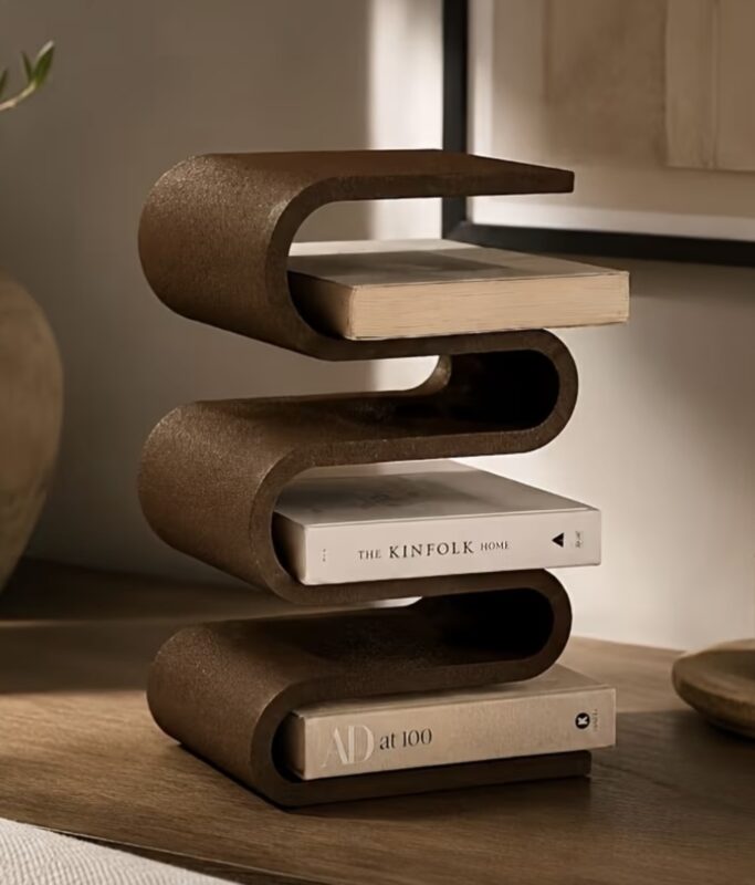 Yellow leather book band holding stack of books on nightstand