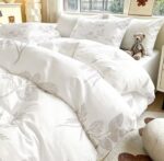 3-piece duvet cover set with two matching pillowcases on a neatly made bed