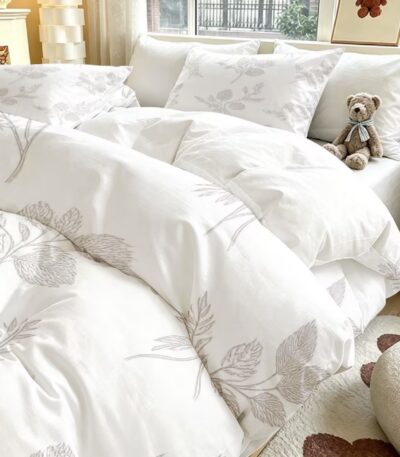 3-piece duvet cover set with two matching pillowcases on a neatly made bed