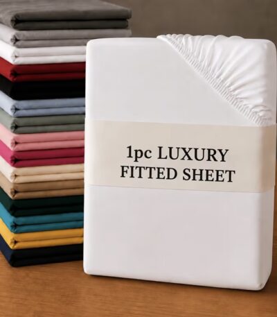 White fitted sheet smoothly fitted on a mattress in a bright bedroom